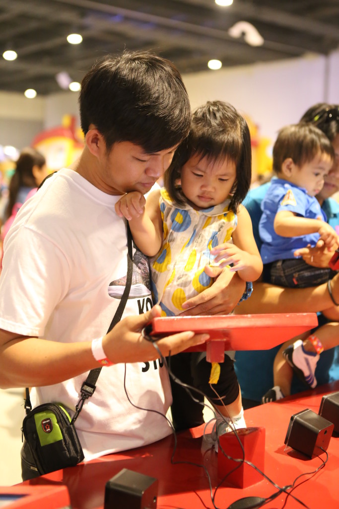 A doting father enjoying the event with his daughter